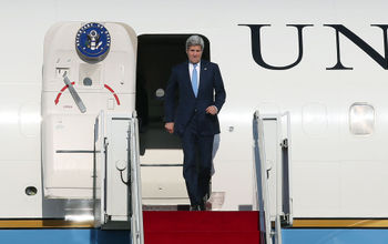 Former Secretary of State John Kerry deplanes upon landing at Seoul Air Base in 2015