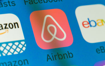 Airbnb icon on computer monitor screen. Airbnb on computer monitor screen.