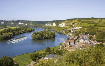 The Scenic Gem sails alongside Normandy.
