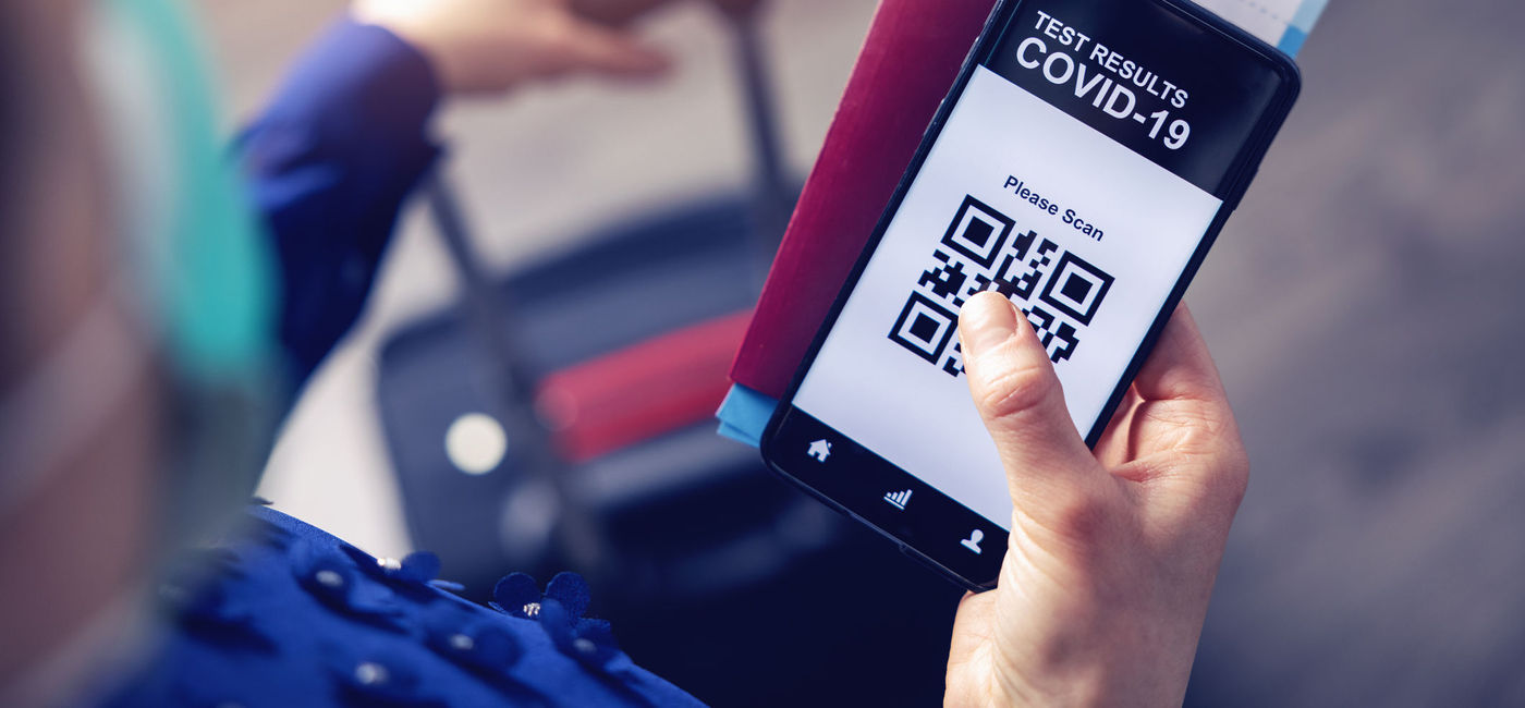 Image: Mobile app displaying QR code linked to traveler's COVID-19 test results. (Photo via iStock/Getty Images Plus/ronstik)