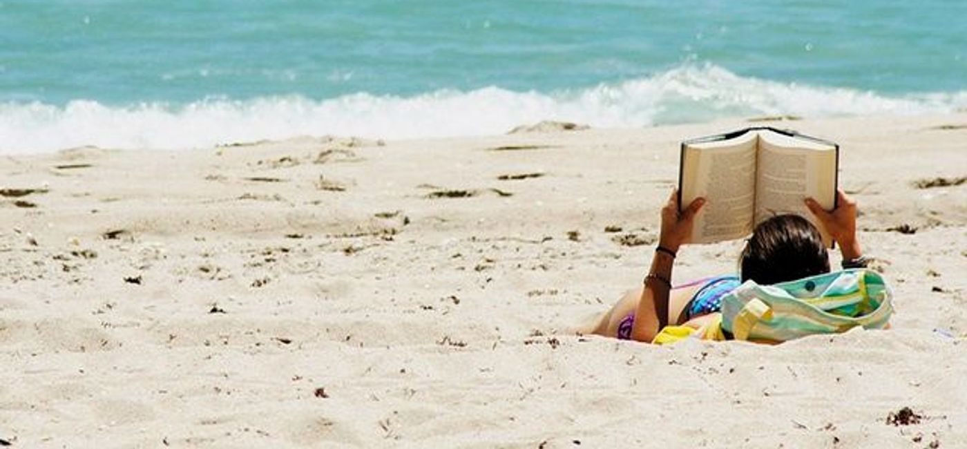 Image: PHOTO: Reading on Beach. (photo via flickr/Josué Goge) (flickr)