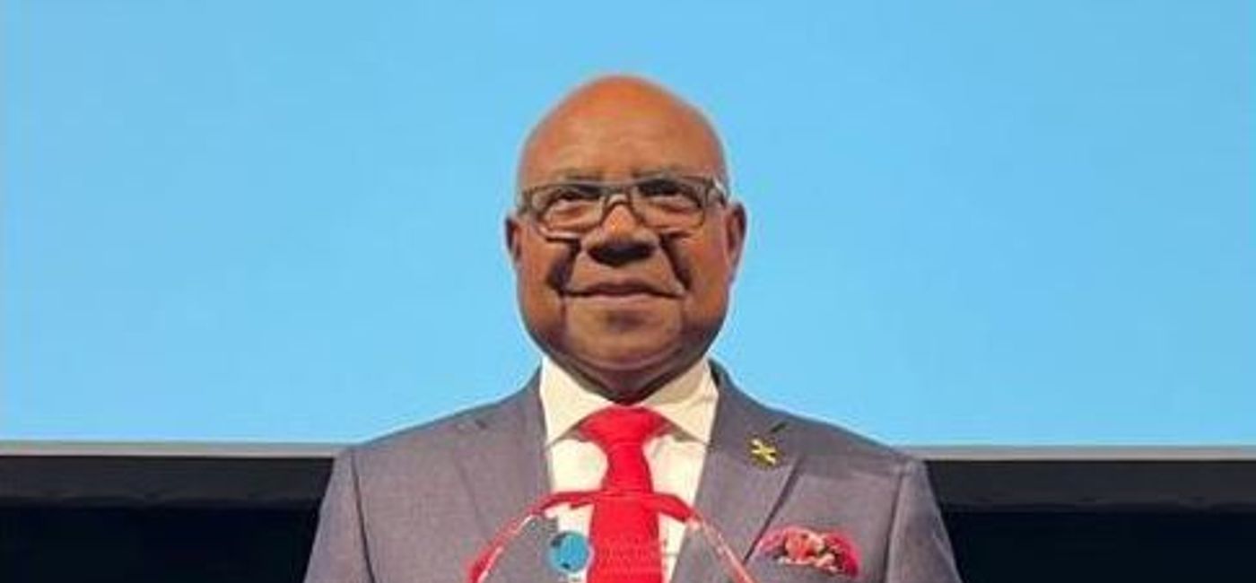 Image: Jamaica's Edmund Bartlett displays his lifetime achievement award presented by the Pacific Area Travel Writers Association. (Ministry of Tourism, Jamaica)
