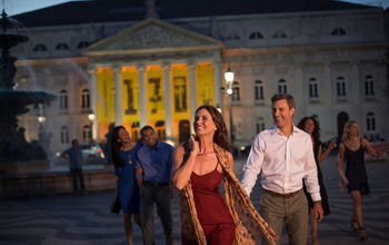 A group exits a theater after attending a concert on a Globus journey.