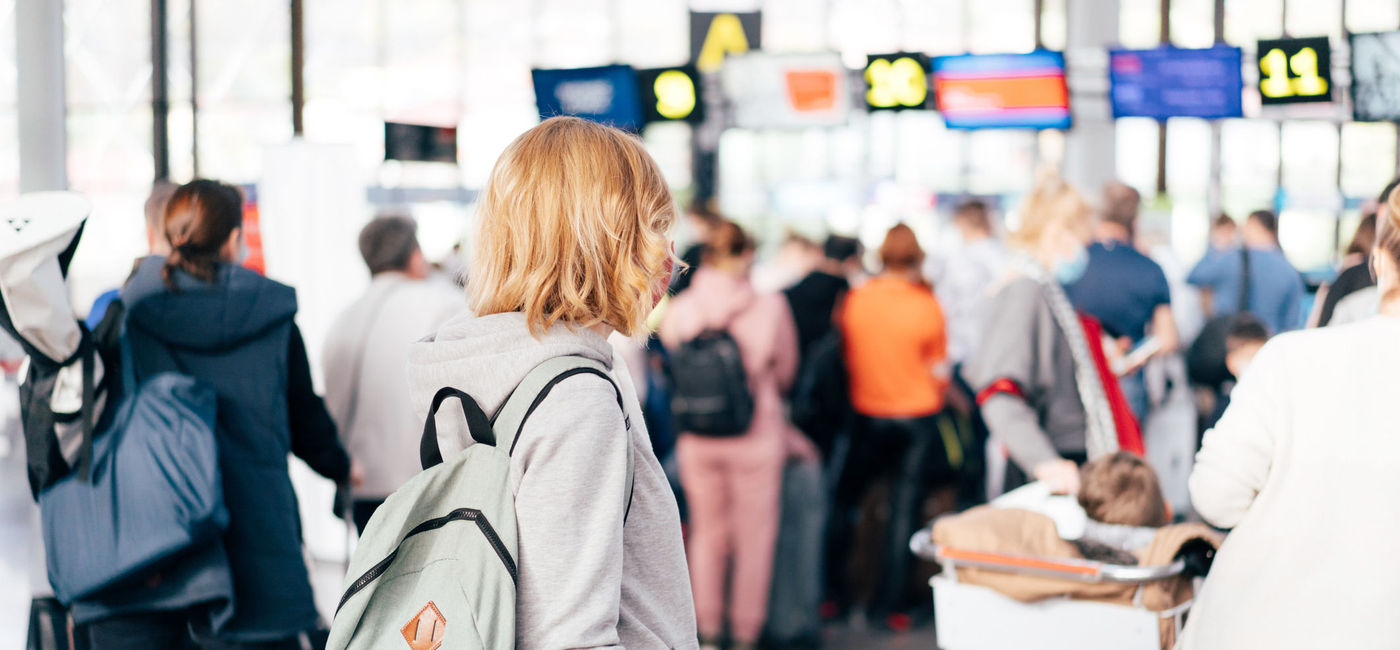 Image: Check-in queue at the airport. (photo via ilona titova / iStock / Getty Images Plus)