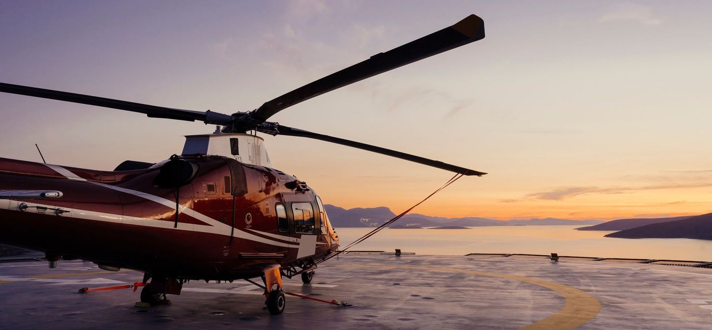 Image: Helicopter landing on an offshore platform. (photo via mrtekmekci / getty images)