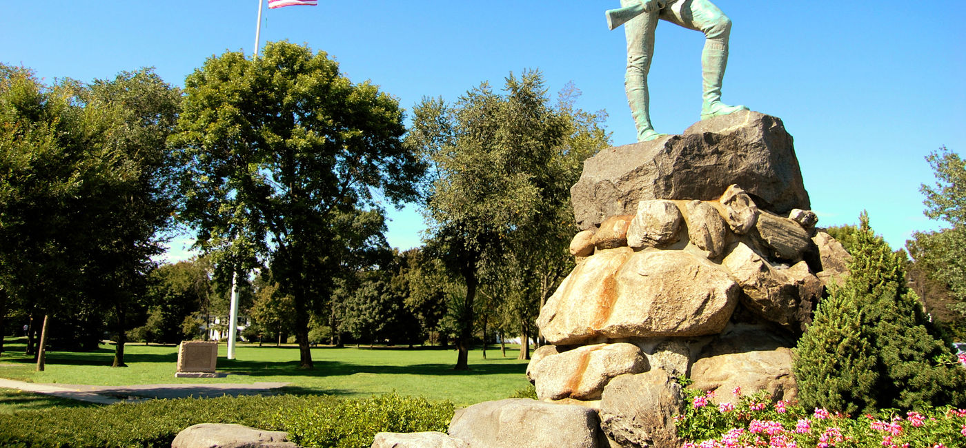 Image: The famous statue of the Revolutionary War minuteman stands tall on Lexington Green (Photo Credit: jmorse2000 / Getty Images)