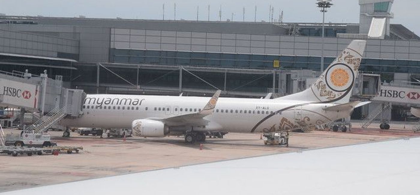 Image: Myanmar National Airlines parked at an airport. (photo via Flickr / Hugh Llewelyn)