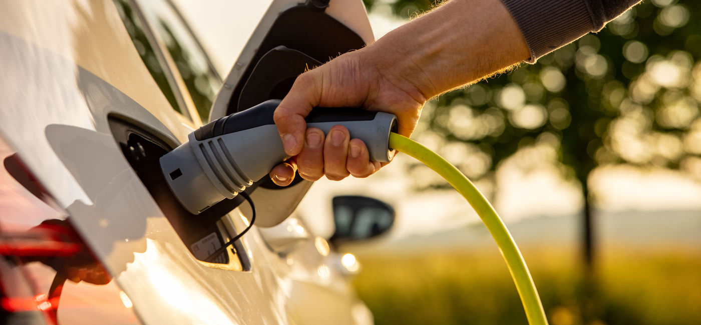 Image: Charging electric vehicle. (photo via SimonSkafar / E+)