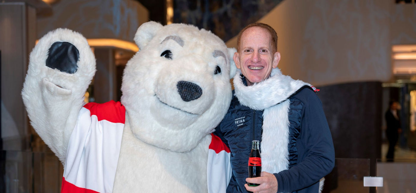 Image: Harry Sommer, president and chief executive officer of Norwegian Cruise Line and Coca-Cola's famous polar bear. (photo courtesy of Norwegian Cruise Line)