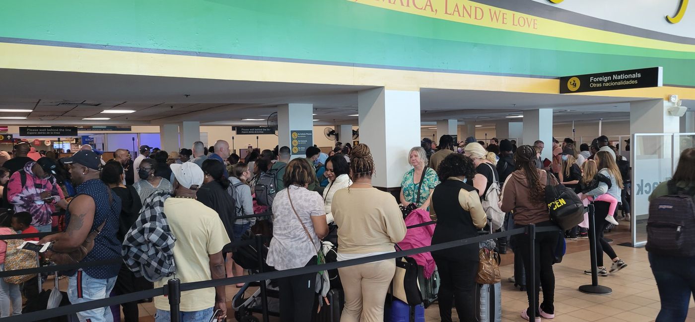 Image: Travelers at Sangster Airport in Montego Bay, Jamaica. (Photo Credit: Brian Major)