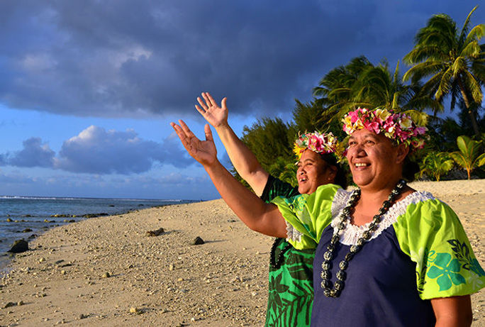 Polynesian Pacific Island Women wave hello to newcomers 