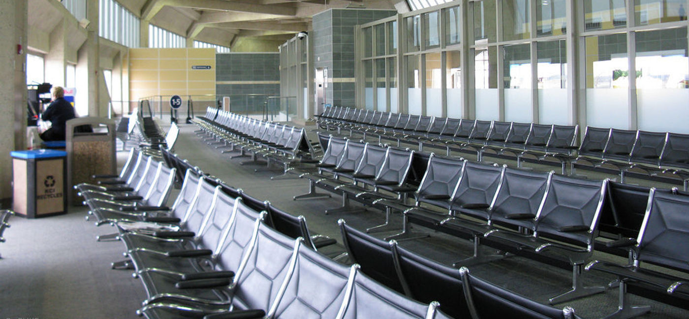 Image: The handrests on chairs at the airport are often covered in bacteria. (photo via Flickr/FHKE)