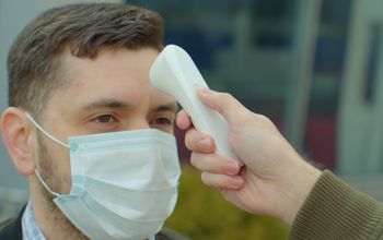 Man undergoing a temperature check