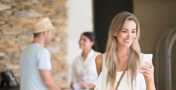 Traveler checking into hotel with mobile app.