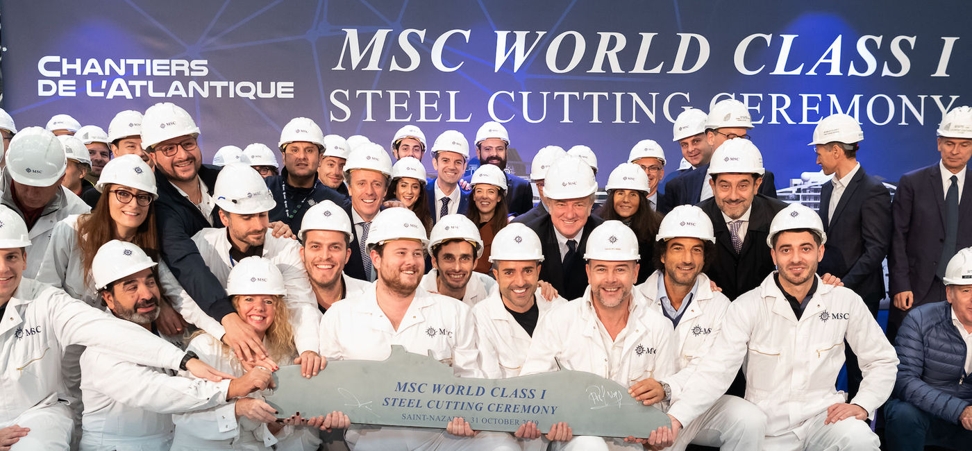 Image: PHOTO: MSC Cruises new-build team poses with key executives from MSC Cruises and Chantiers del’Atlantique. (photo via MSC Cruises)