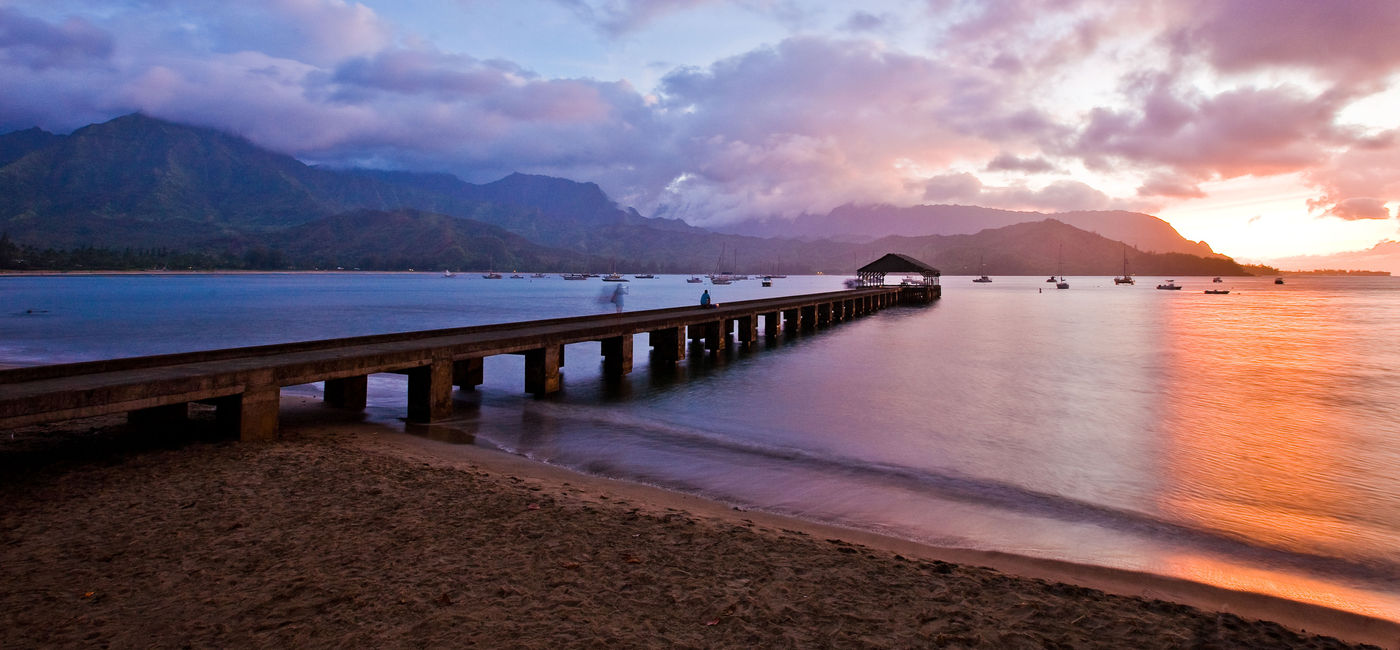 Photo: Hanalei Pier at Sunset (Photo via Hawaii Tourism Authority (HTA) / Tor Johnson)