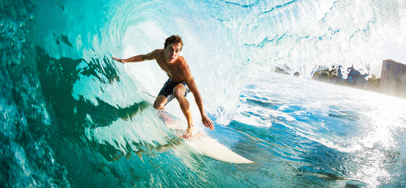 Image: PHOTO: Close-up of a surfer in the tube getting barreled. (photo via iStock/Getty Images Plus/EpicStockMedia)