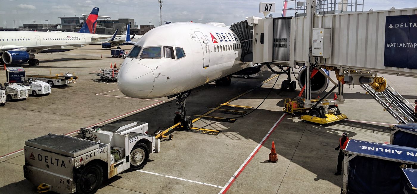 Image: A Delta plane waiting at a gate. (photo by Eric Bowman)