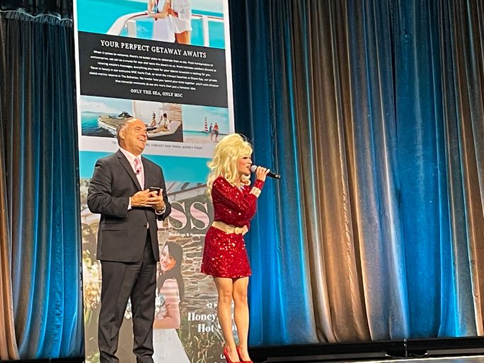 Stephen McGillivray, chief marketing officer of Travel Leaders Group, with a Dolly Parton impersonator at the EDGE conference in Nashville. 