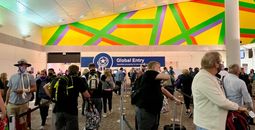 A view of Global Entry kiosks through a long line at Dallas Fort Worth airport
