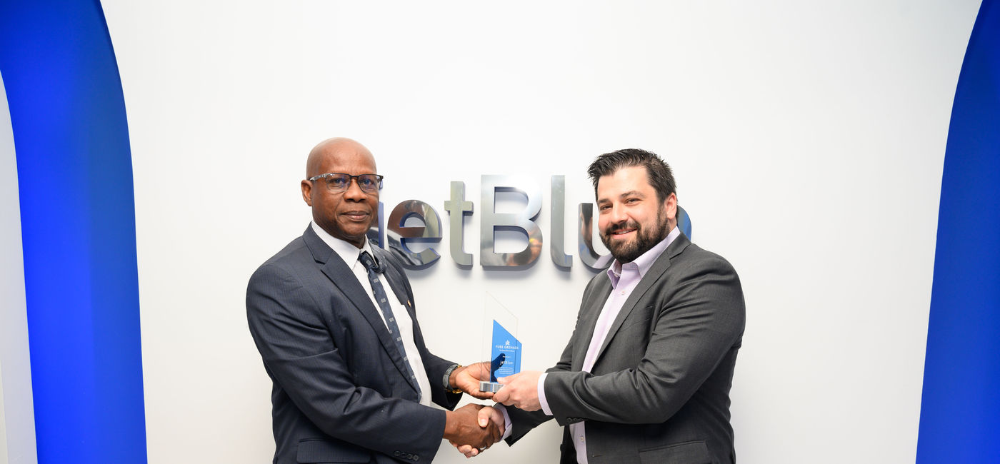 Image: Grenada Tourism Minister Lennox Andrews with Eric Friedman, Director of Route Planning, JetBlue. (Photo Credit: Grenada Tourism Authority)