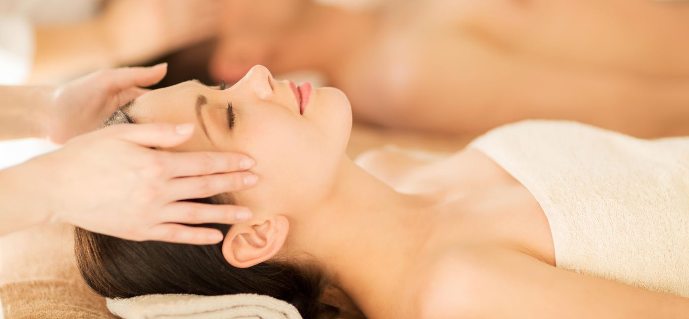 Image: PHOTO: A couple in spa salon getting face treatment. (photo via dolgachov / iStock / Getty Images Plus)