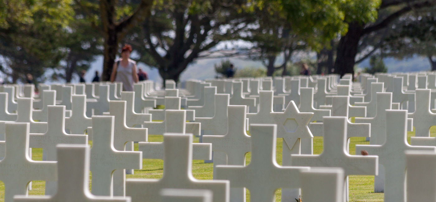 Image: Gravestones at the Normandy American Cemetery. (Photo via Stig Nygaard / Flickr) 