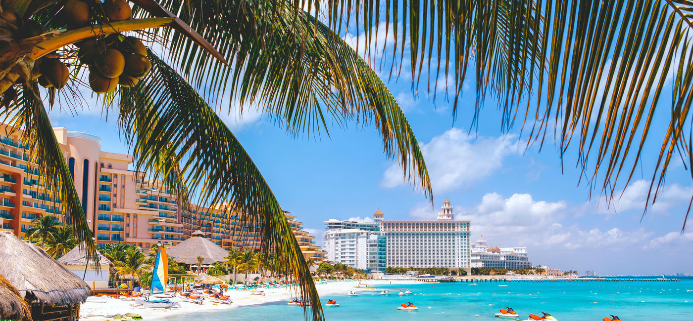 Image: Cancun beach with hotels. (photo viapawel.gaul / iStock / Getty Images Plus)