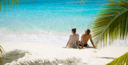 Couple relaxing on a beach in the Caribbean