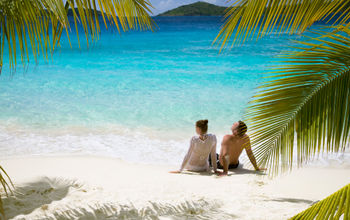 Couple relaxing on a beach in the Caribbean