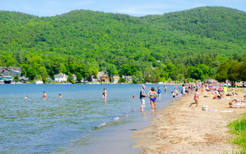 Crowd of swimmers on the beach in Lake George, New York
