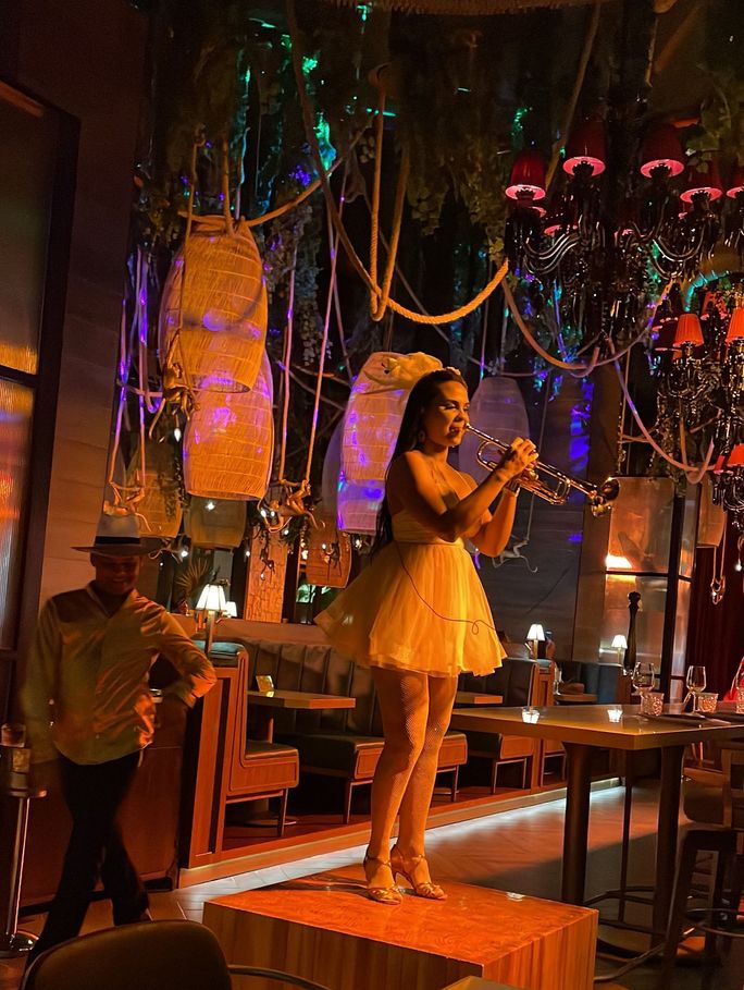A trumpeter performs “Havana” tableside
