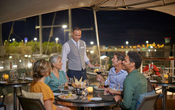 Outdoor dining at Candles restaurant onboard the Star Pride