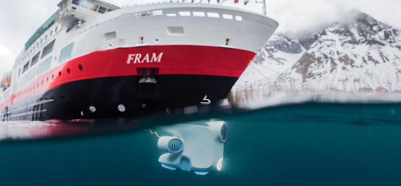Image: PHOTO: Underwater drone below Hurtigruten's Fram. (photo courtesy of Hurtigruten)