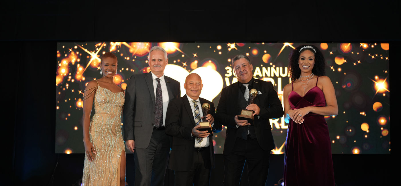 Image: From left to right: Sandals Resorts International’s CEO, Gebhard Rainer; Managing Director for the Eastern Caribbean, Winston Anderson; and Sandals Grande St. Lucian’s General Manager, Michael Nassiri, accepting the ‘Caribbean's Leading Honeymoon Resort 2023’ and ‘St. Lucia's Leading All-Inclusive Resort 2023’ awards.    (Photo Credit: Sandals Resorts WTA)