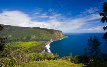 Green bay and valley near blue ocean