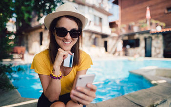 Woman booking travel from her phone