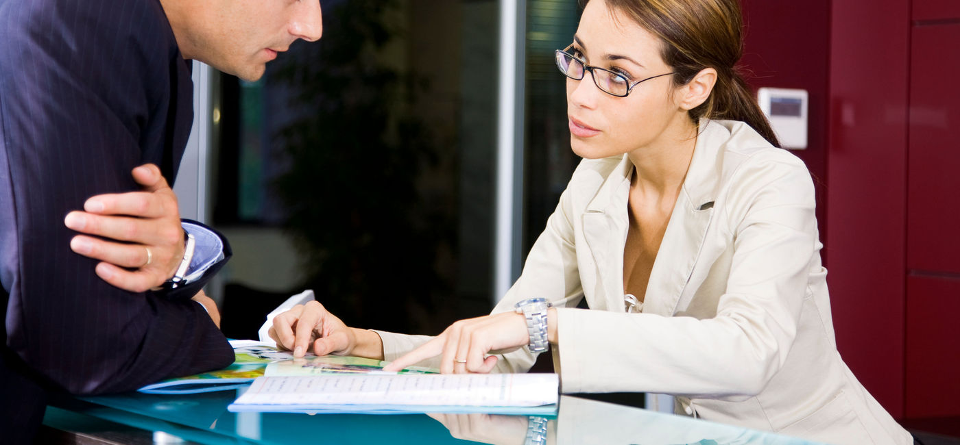 Image: PHOTO: Travel agent speaking with a client. (photo via diego_cervo/iStock/Getty Images)