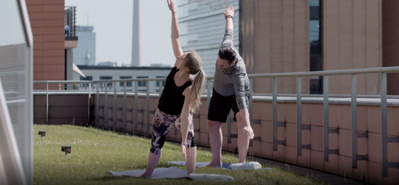 Image: PHOTO: Guests enjoy private rooftop yoga at Grand Hyatt Berlin. (photo via Hyatt Hotels)