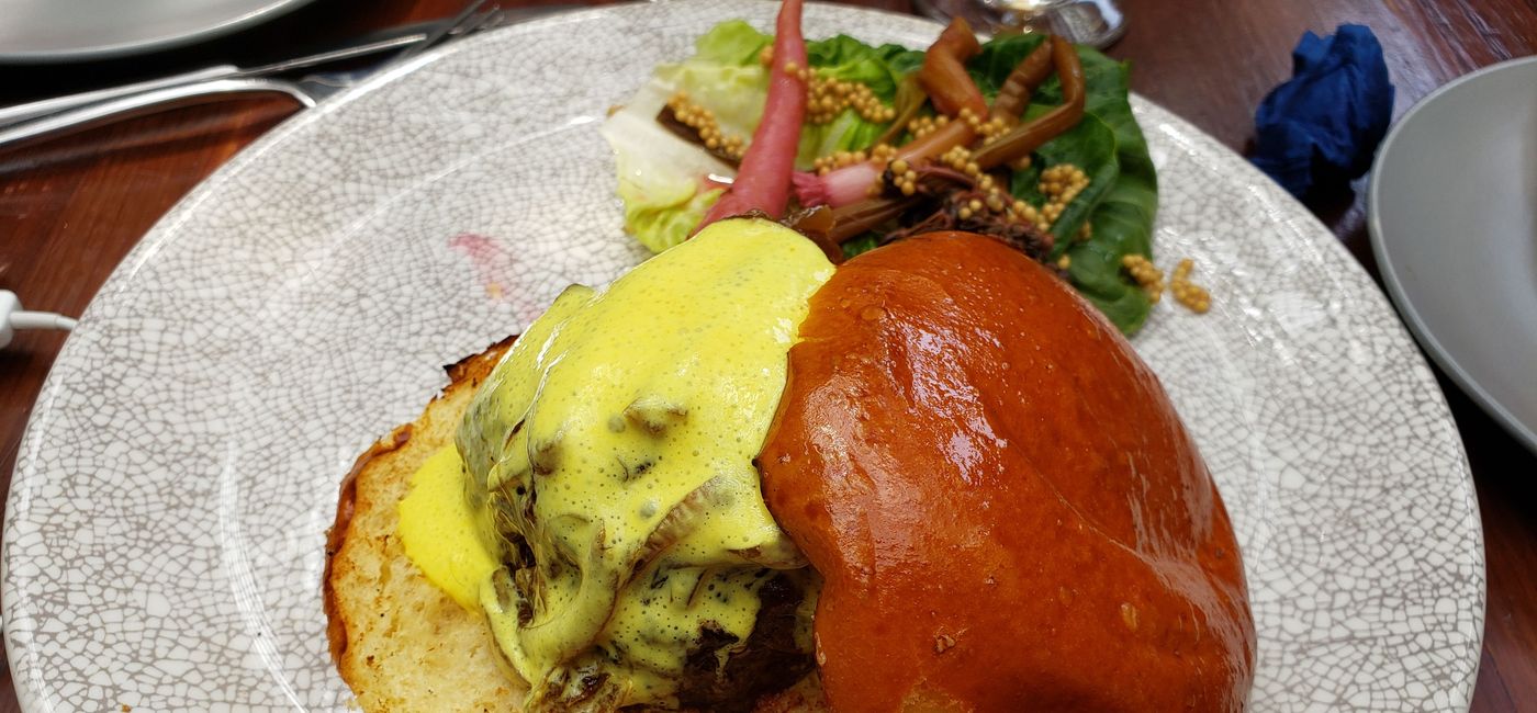 Image: PHOTO: The burger, quite delicious by airline food status, is being removed from American's menus. (Photo by Joe Pike)