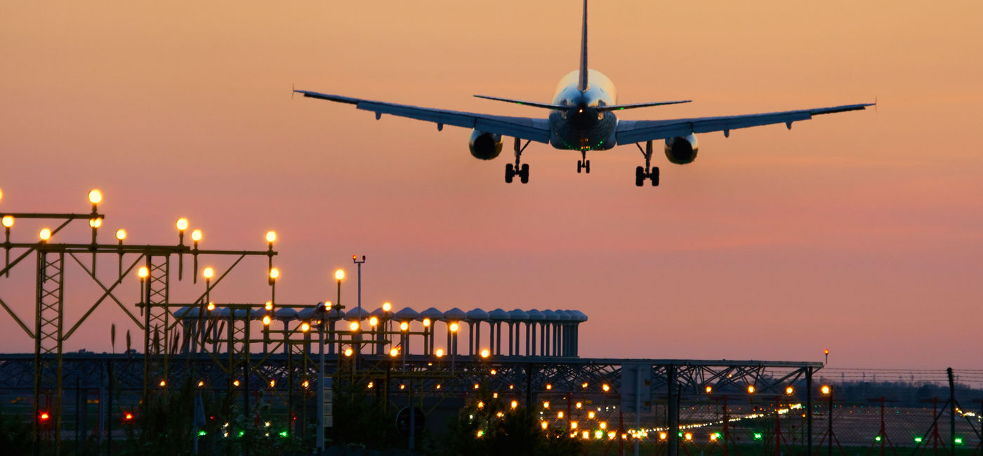 Image: Airplane landing at sunset. (Photo via imv/iStock/Getty Images)