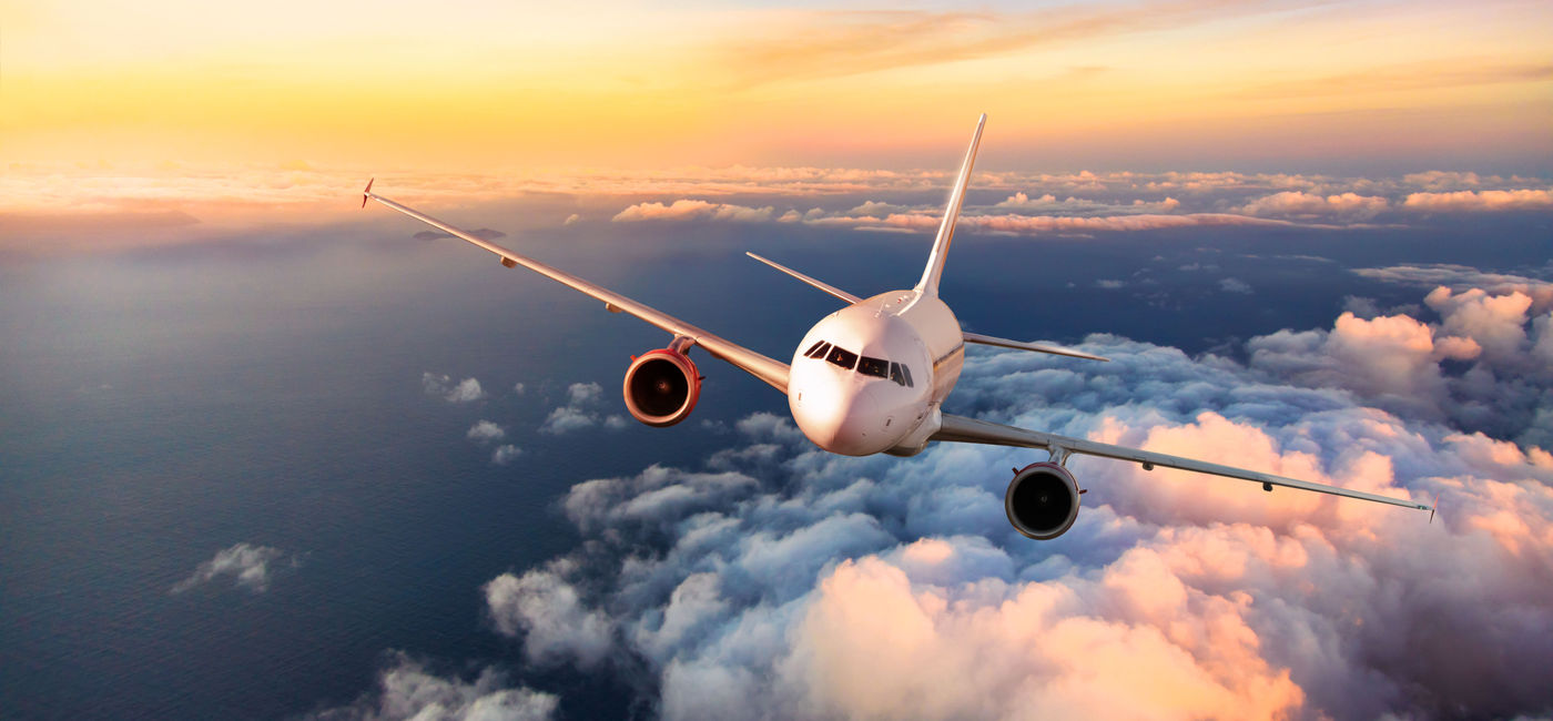 Image: Commercial airplane flying above clouds. (Photo via Jag_cz/iStock/Getty Images)