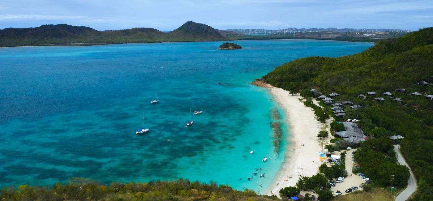 Image: Hermitage Bay, Antigua. (photo via iStock / Getty Images Plus / cdwheatley)