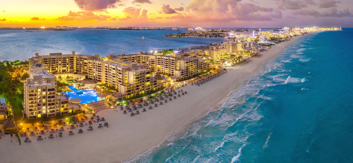 Image: Sunset in Cancun. (photo via iStock/Getty Images Plus/Jonathan Ross)