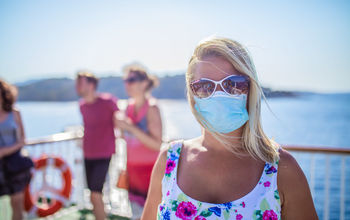 Masked cruise ship passenger.