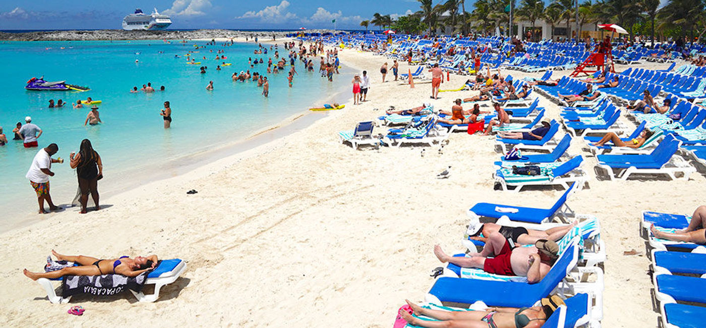 Image: PHOTO: Bertram's Cove main beach at Norwegian Cruise Line's Great Stirrup Cay private island with Norwegian Sky in the distance. (photo by Jason Leppert)