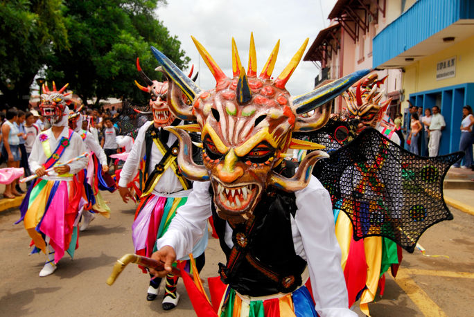 Diablicos Sucios dance along the streets during the festival of Corpus Christi in Los Santos. Panama Tourism Authority, panamanian culture, diablicos sucios
