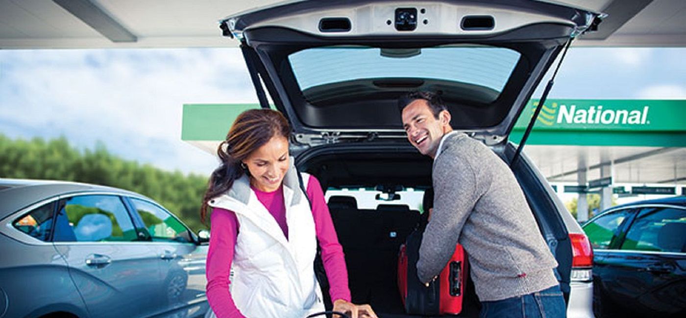 Image: A couple renting a car from National. (photo via Enterprise Holdings) (Enterprise)