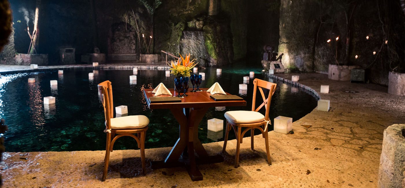 Image: The private dinner set up at Rio Azul Cenote (photo via Hoteles Xcaret)