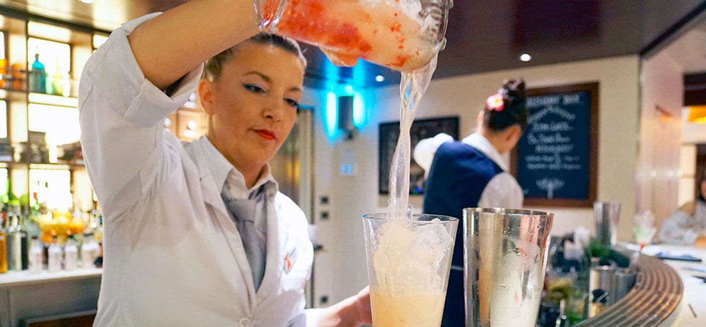 Image: PHOTO: "Pharmacist" pouring at the Alchemy Bar aboard Carnival Cruise Line's Carnival Vista. (photo by Jason Leppert)